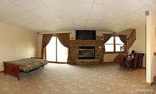 5866 Hay Rake Hollow Gregory, MI 48137 - Photo 8 of 15 Finished walkout w/ fireplace