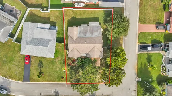 an aerial view of a house with a garden