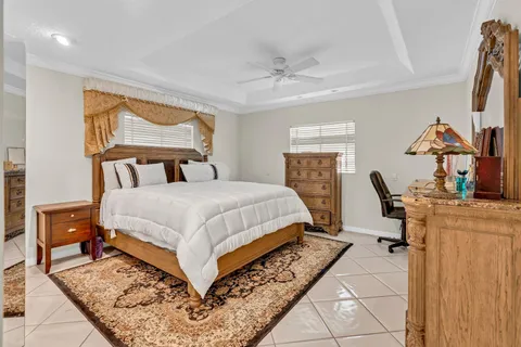 a bed room with a bed and a mirror