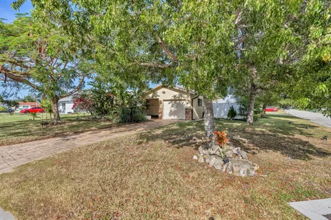 a backyard of apartments with large trees