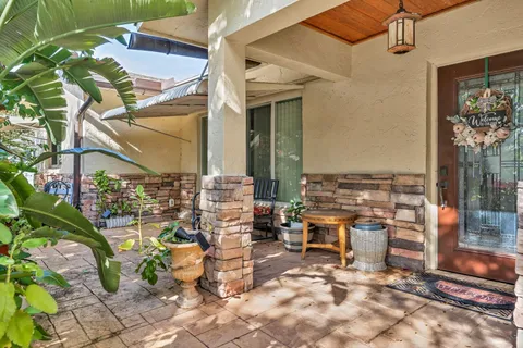 a view of a chairs and table in the patio