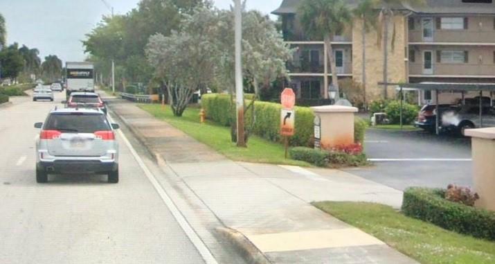 5419 Rattlesnake Hammock Road, Unit F204 Naples, FL 34113 - Photo 1 of 8 a view of a street with cars