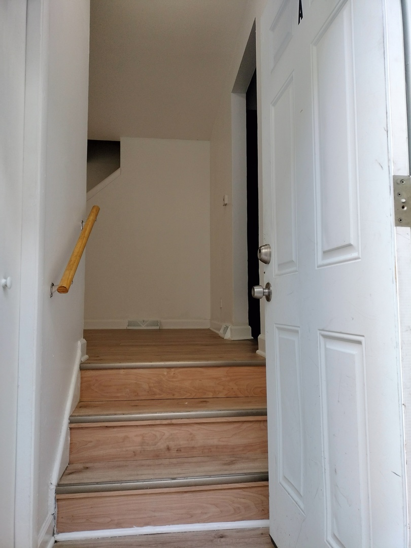 7910 South Muskegon Avenue, Unit 1 Chicago, IL 60617 - Photo 3 of 21 a view of entryway
