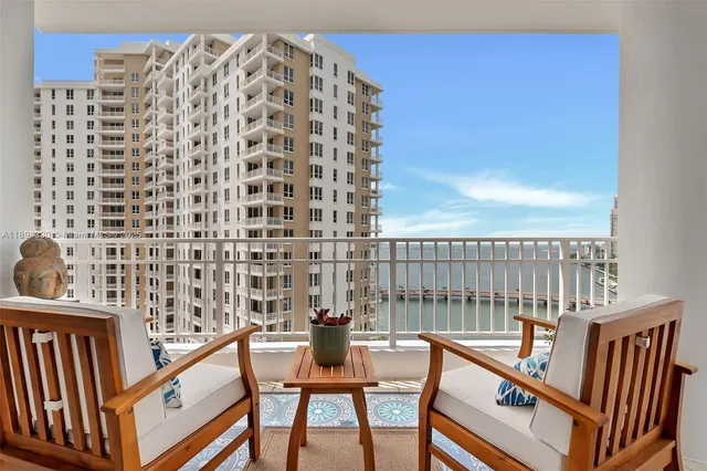 a view of a balcony with chairs