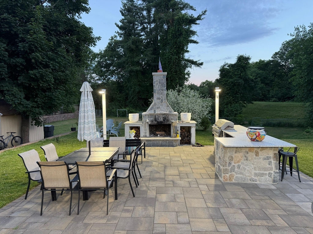 104 Southwest Cutoff Northborough, MA 01532 - Photo 32 of 33 a view of a dinning table and chairs in the patio