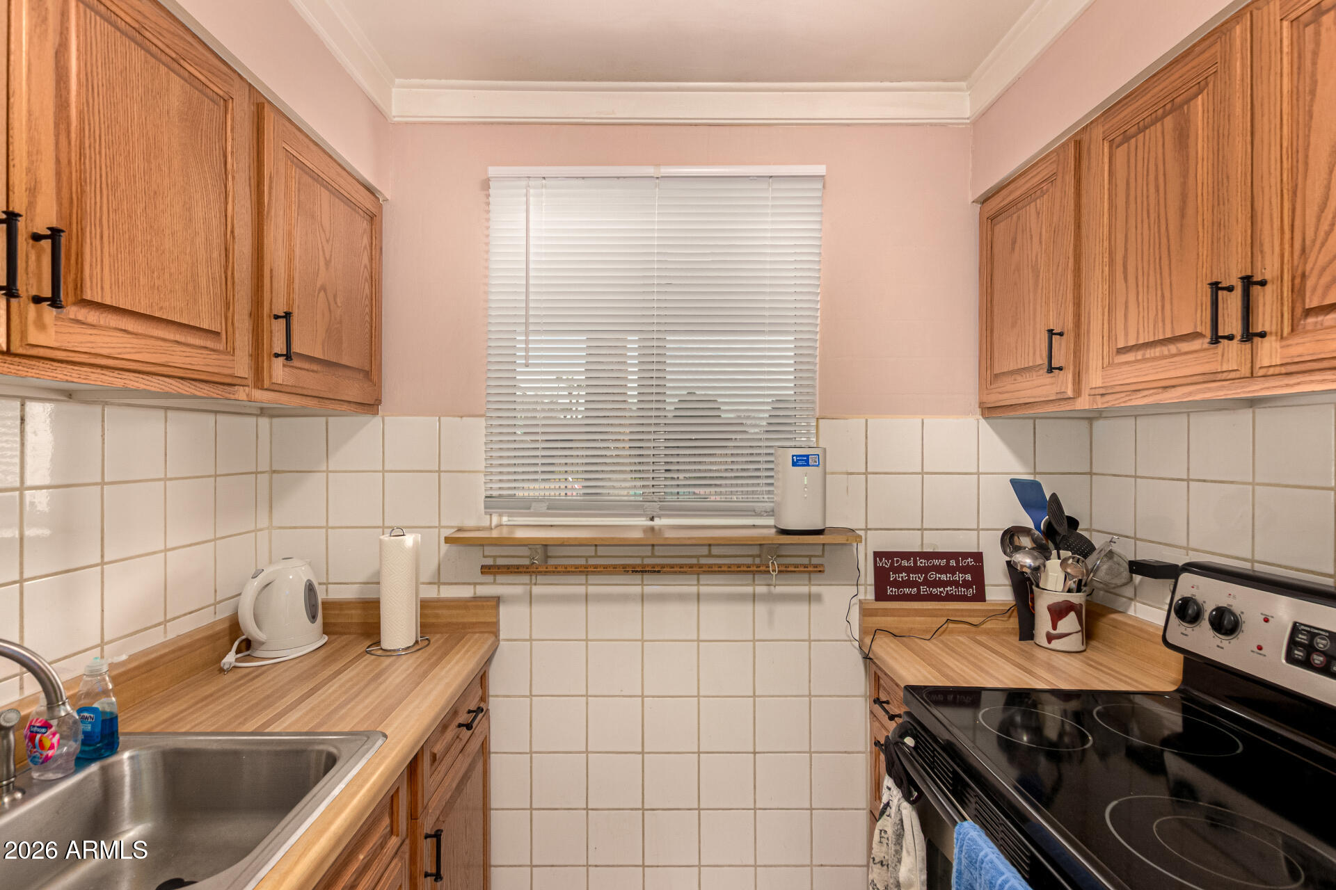 1908 West Berridge Lane, Unit 1 Phoenix, AZ 85015 - Photo 13 of 29 a kitchen with stainless steel appliances a sink stove and cabinets