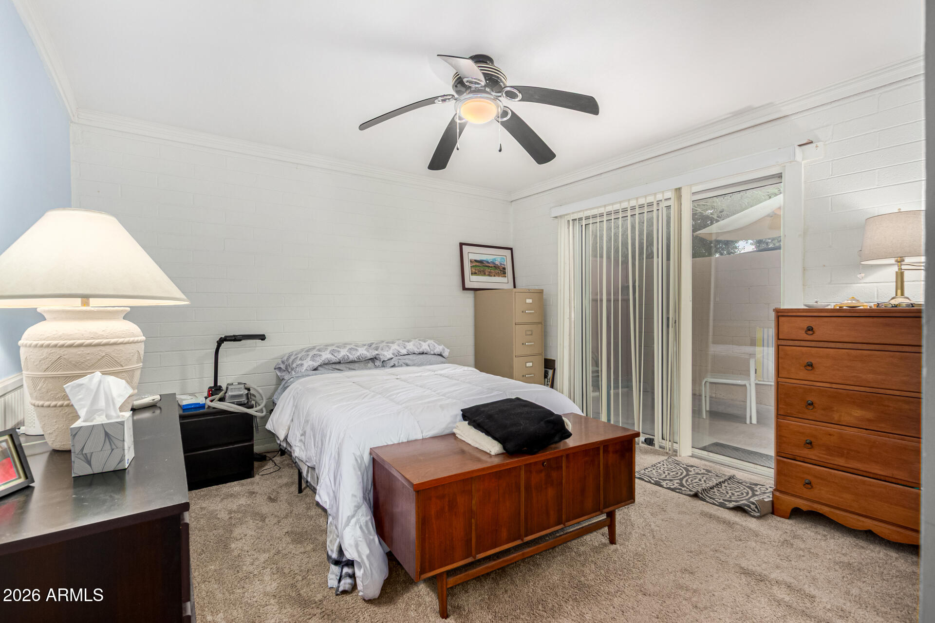 1908 West Berridge Lane, Unit 1 Phoenix, AZ 85015 - Photo 15 of 29 a bedroom with a bed and a chandelier