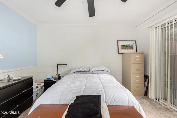a bedroom with a bed and a cabinets