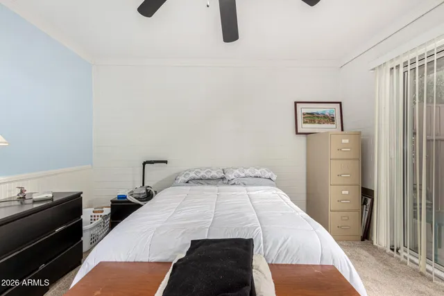 a bedroom with a bed and a cabinets