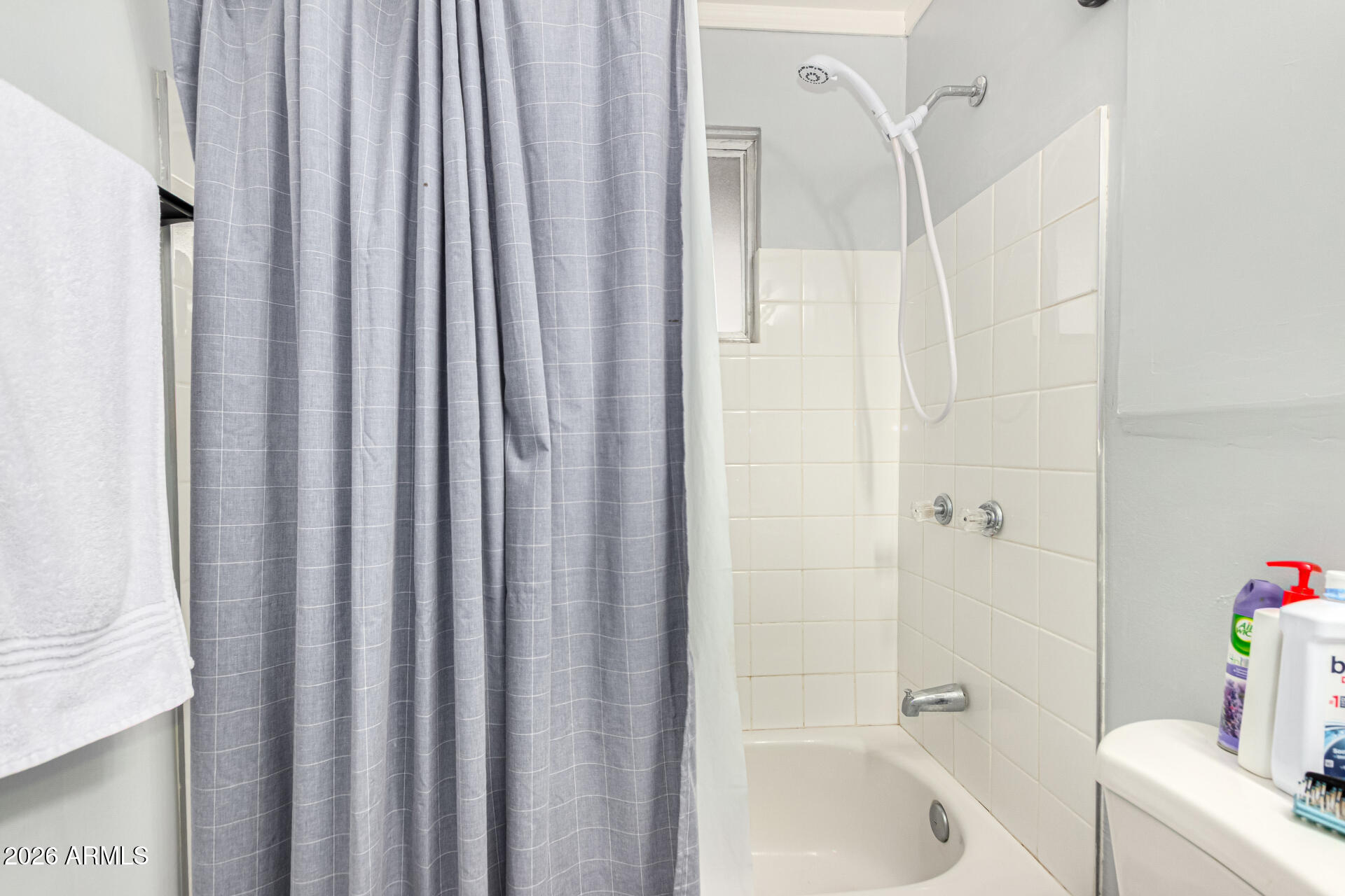 1908 West Berridge Lane, Unit 1 Phoenix, AZ 85015 - Photo 19 of 29 a bathroom with a tub and shower