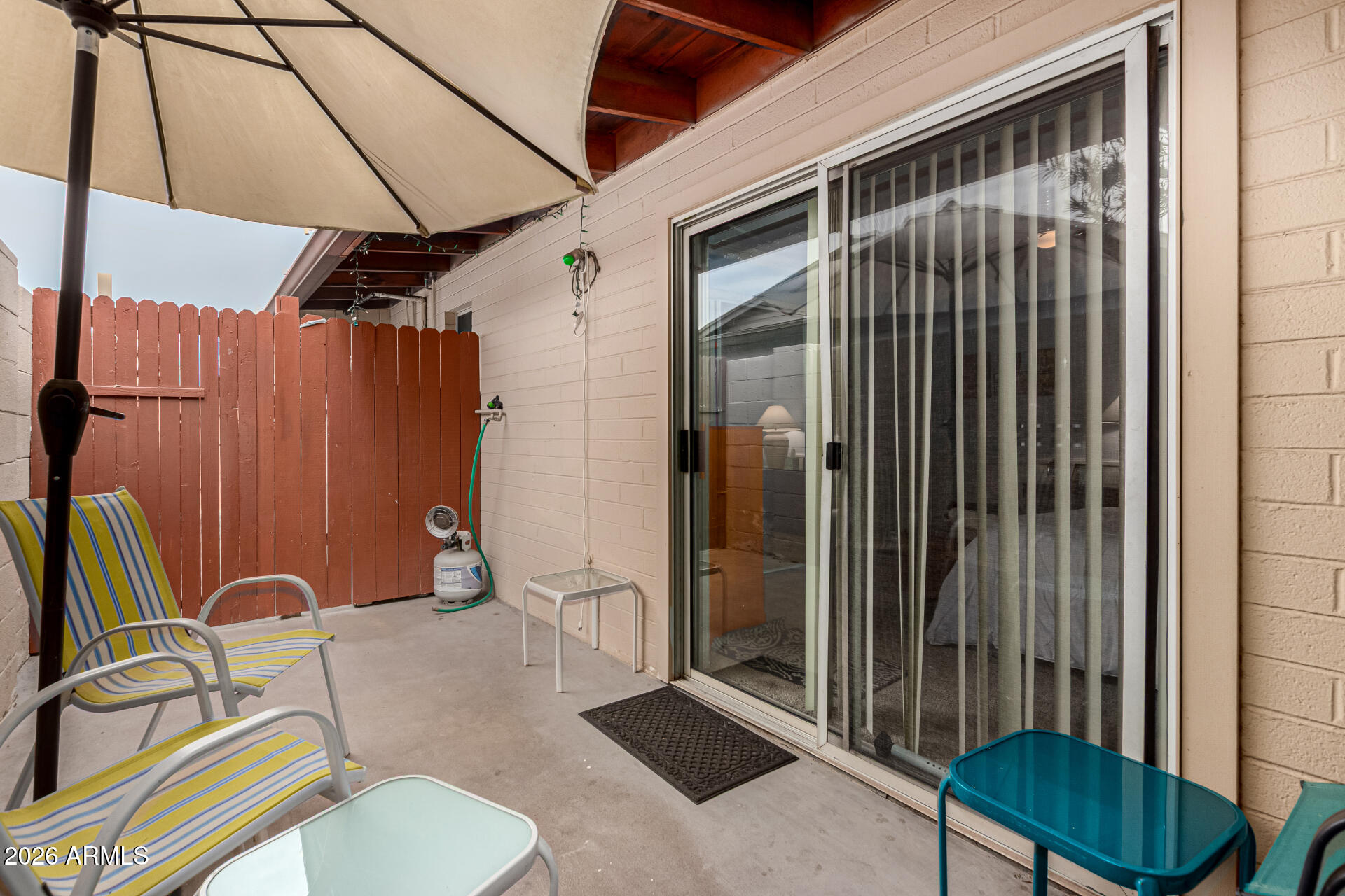 1908 West Berridge Lane, Unit 1 Phoenix, AZ 85015 - Photo 20 of 29 a backyard of a house with barbeque oven table and chairs