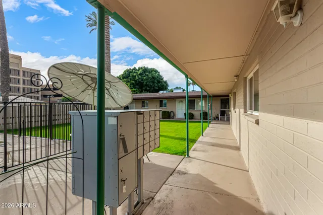 a view of a house with a backyard and porch