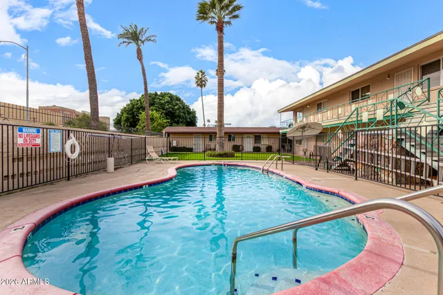 a view of a swimming pool with a patio