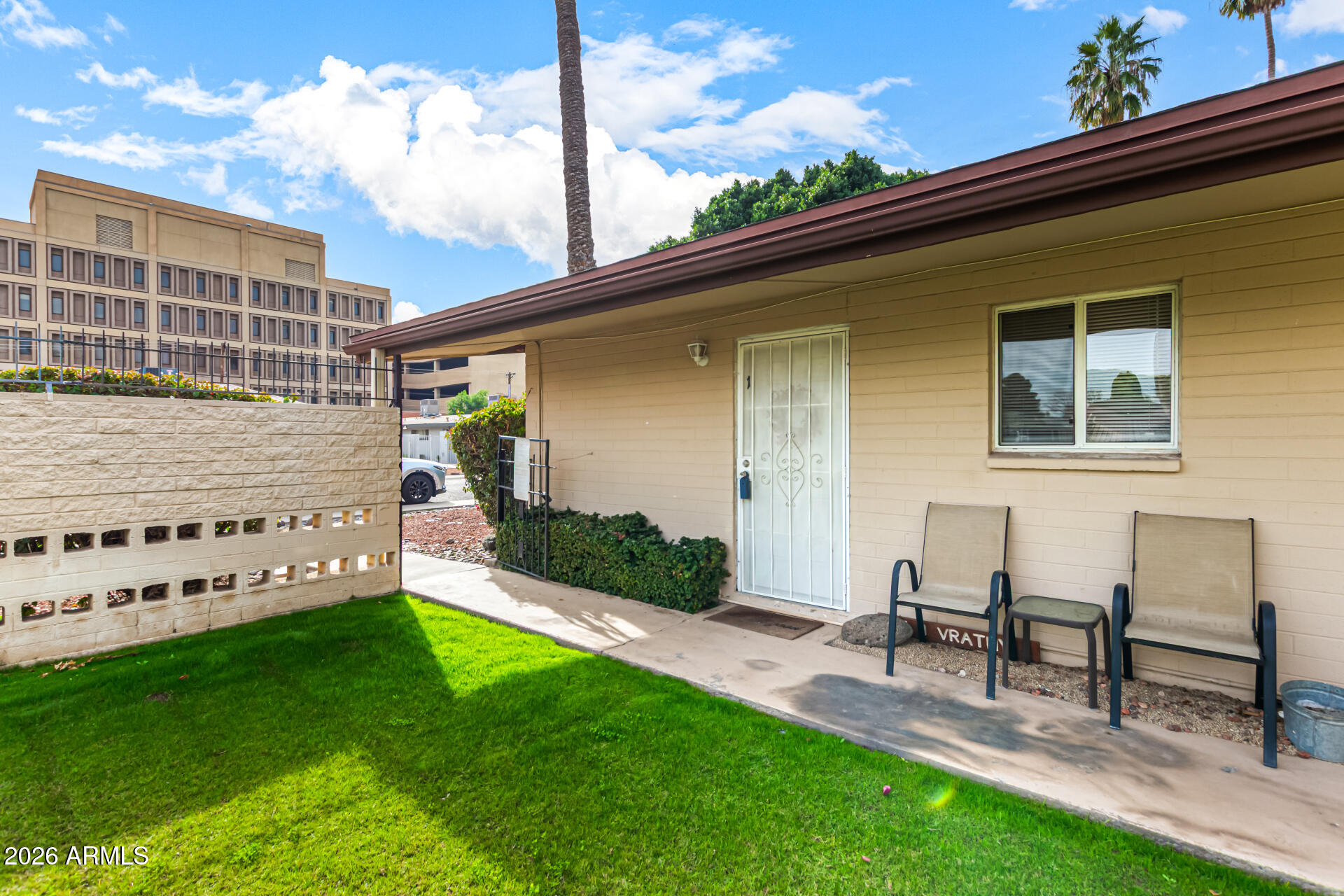1908 West Berridge Lane, Unit 1 Phoenix, AZ 85015 - Photo 3 of 29 a view of a chair and table in backyard of the house