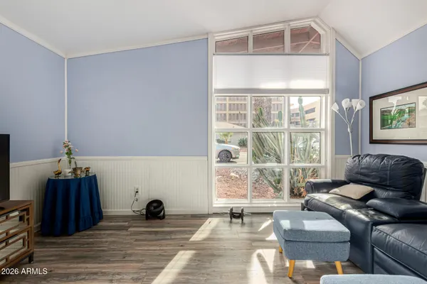 a living room with furniture and a window