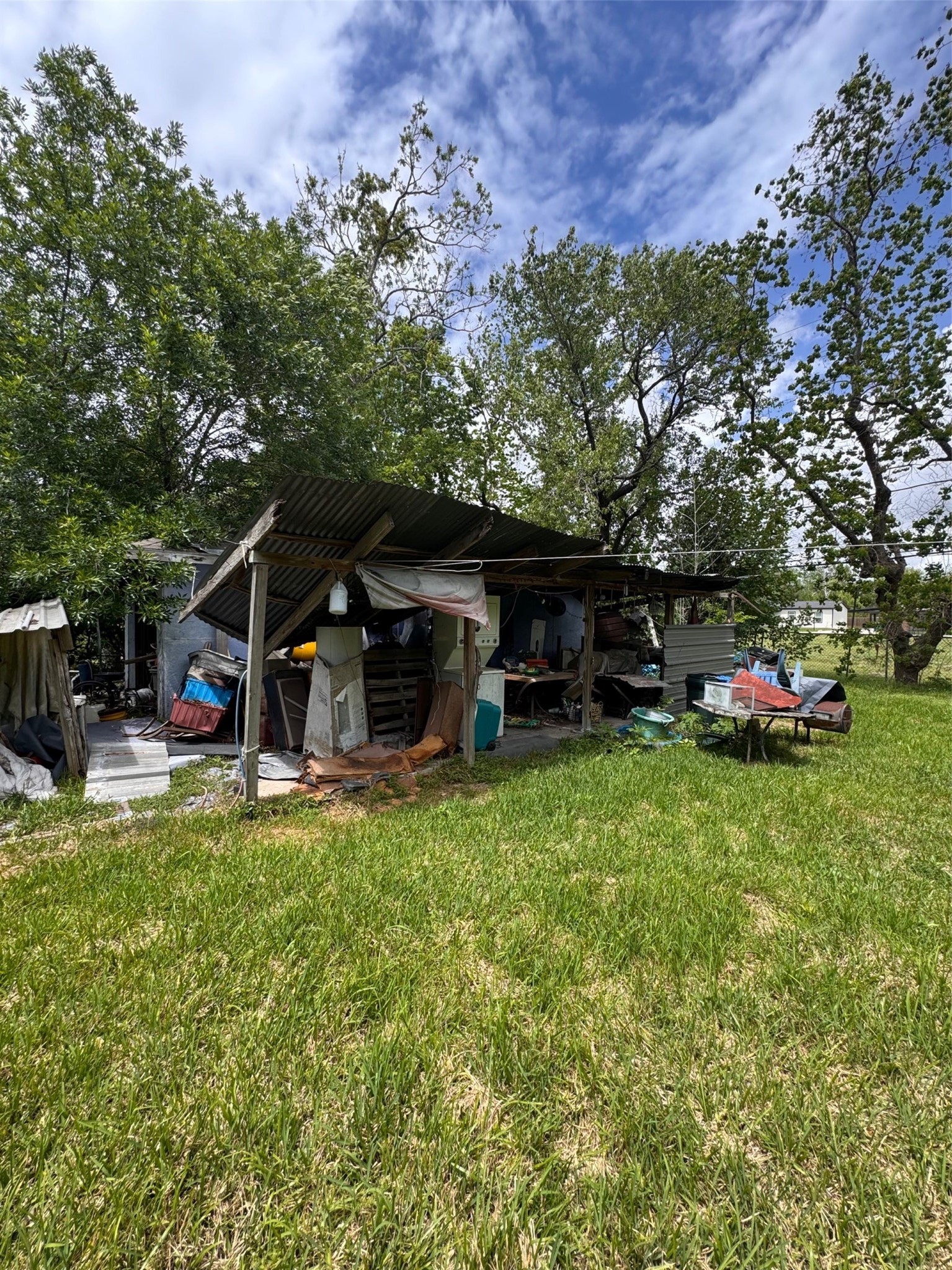 6021 Hertford Street Houston, TX 77048 - Photo 15 of 16 a view of a house with backyard sitting area and garden