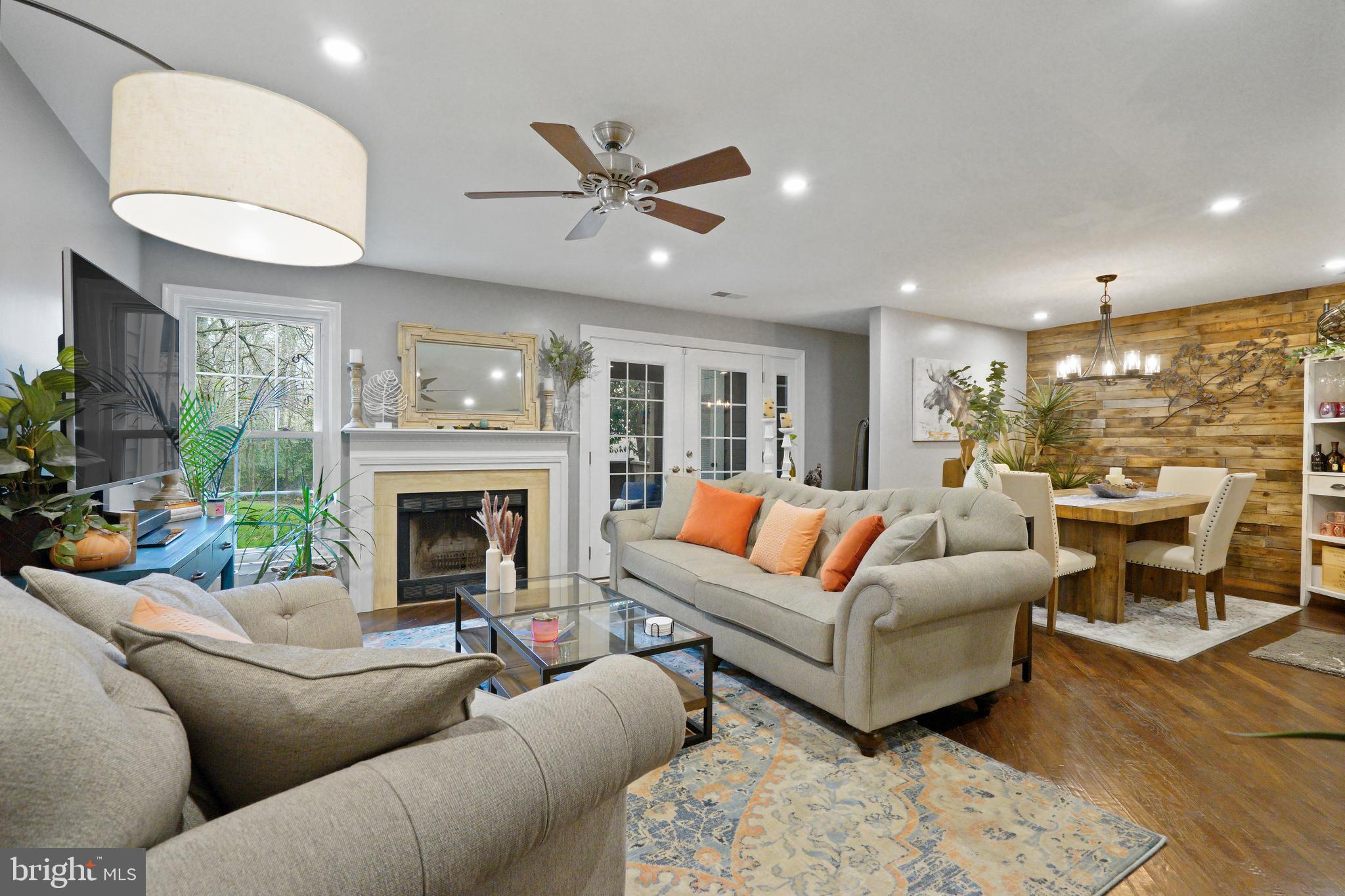 1435 Church Hill Place Reston, VA 20194 - Photo 1 of 30 a living room with furniture and a fireplace