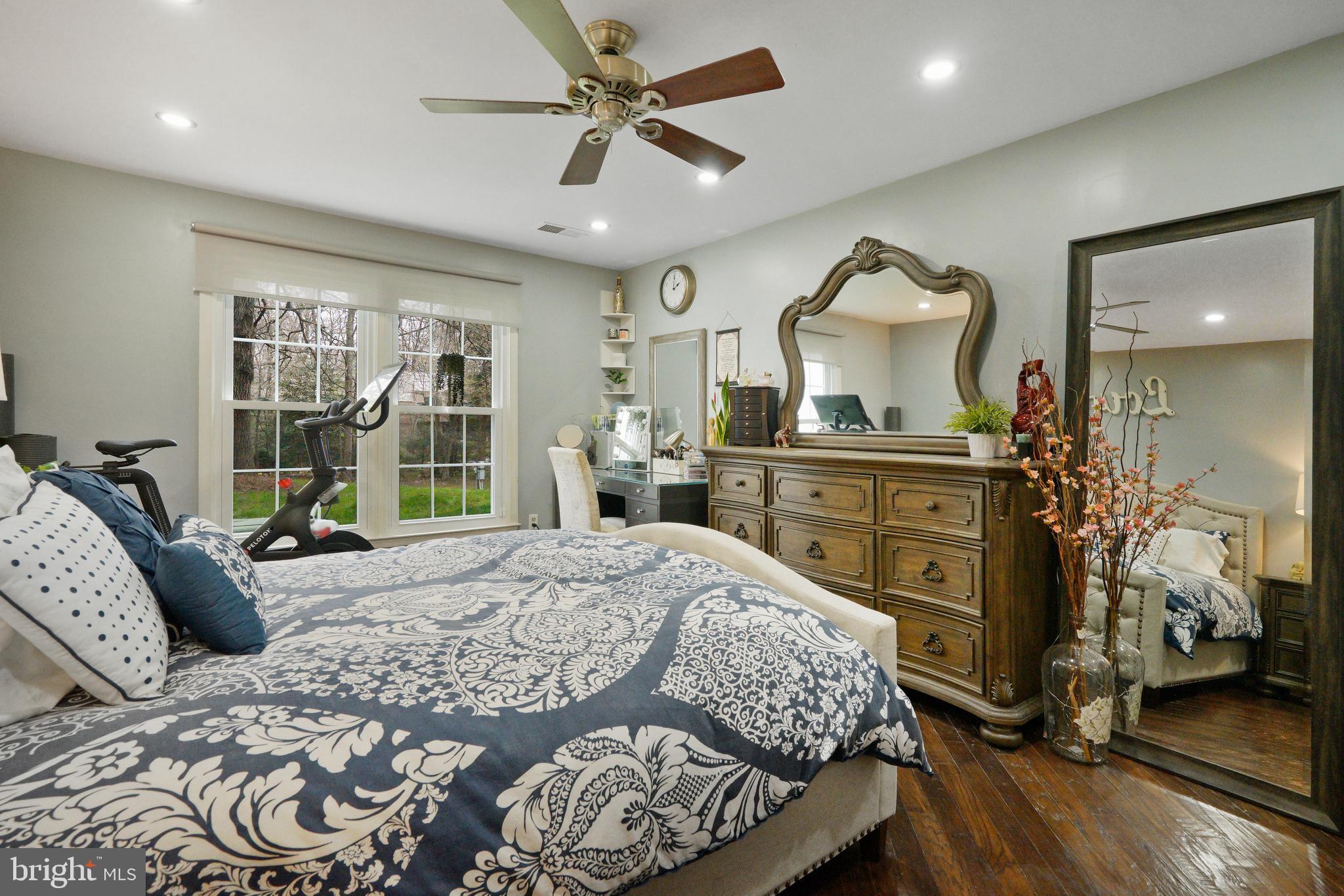 1435 Church Hill Place Reston, VA 20194 - Photo 11 of 30 a bedroom with a bed and wooden floor