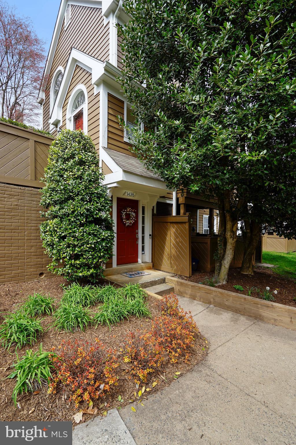 1435 Church Hill Place Reston, VA 20194 - Photo 18 of 30 a front view of a house with a yard and garage