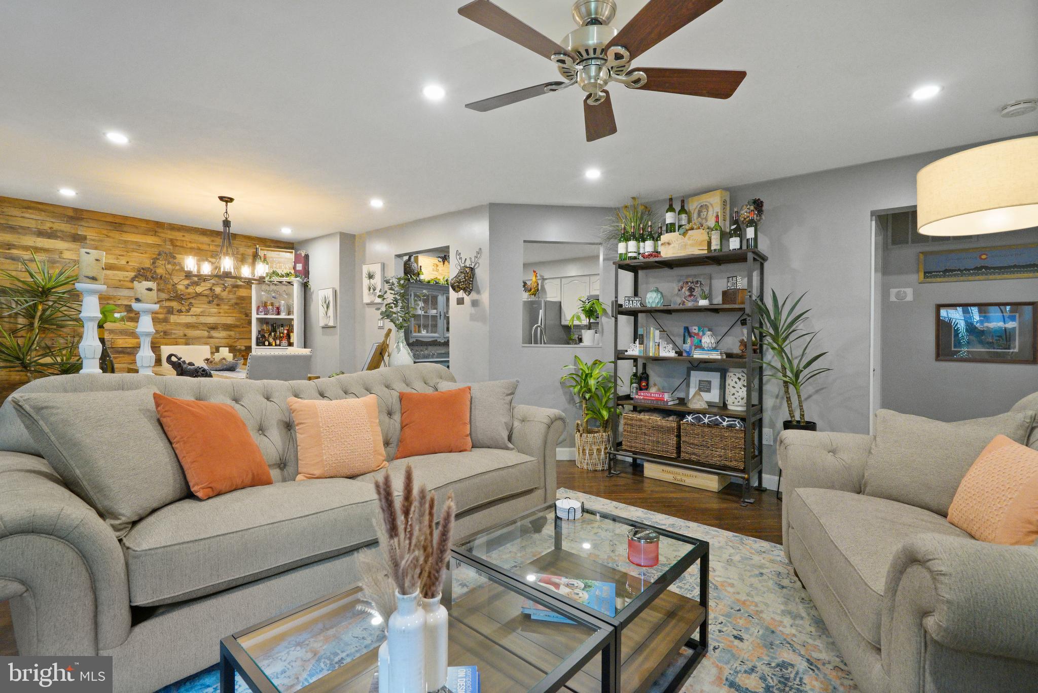 1435 Church Hill Place Reston, VA 20194 - Photo 2 of 30 a living room with furniture kitchen view and a wooden floor