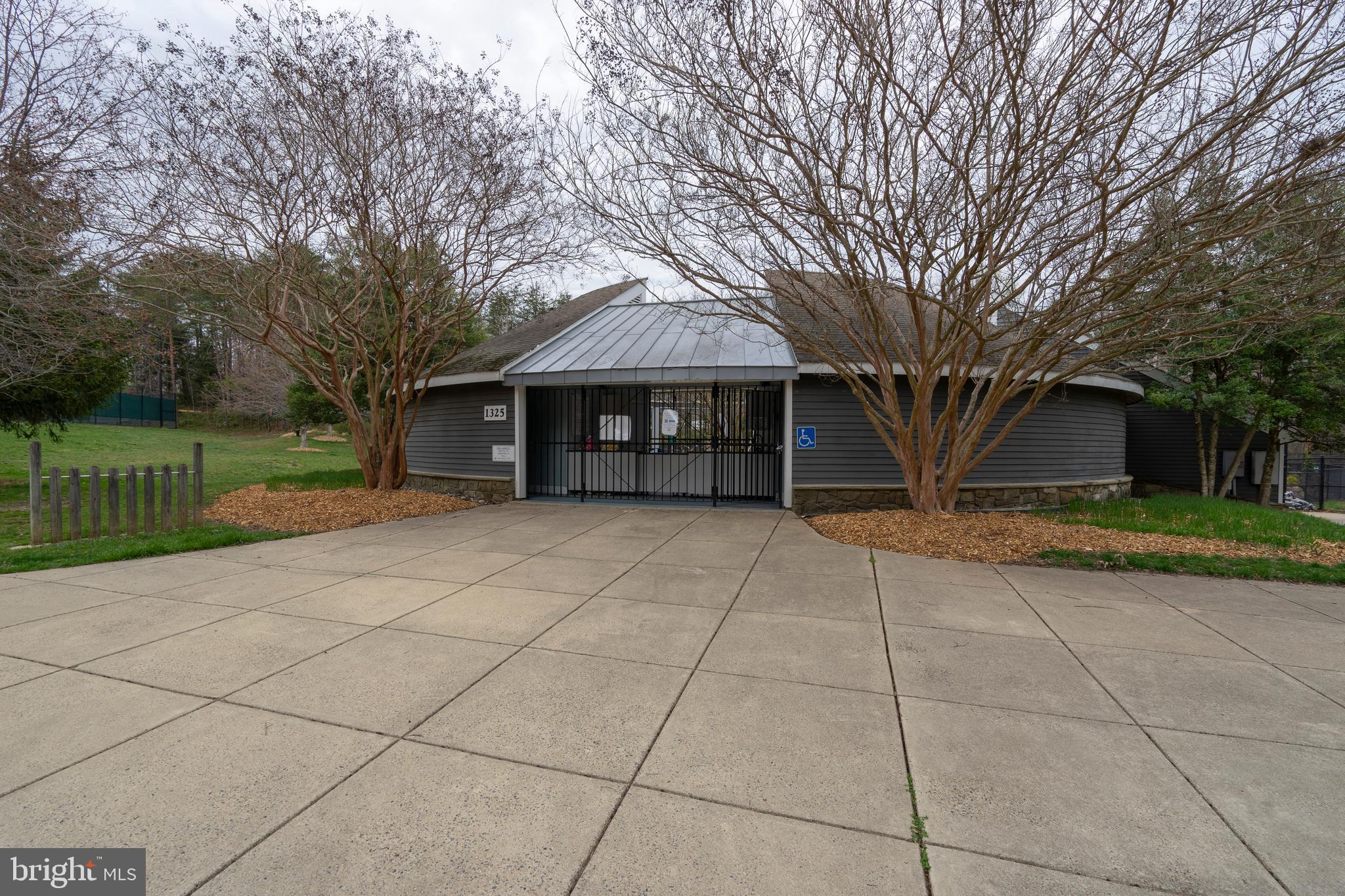 1435 Church Hill Place Reston, VA 20194 - Photo 24 of 30 a front view of a house with a yard and trees