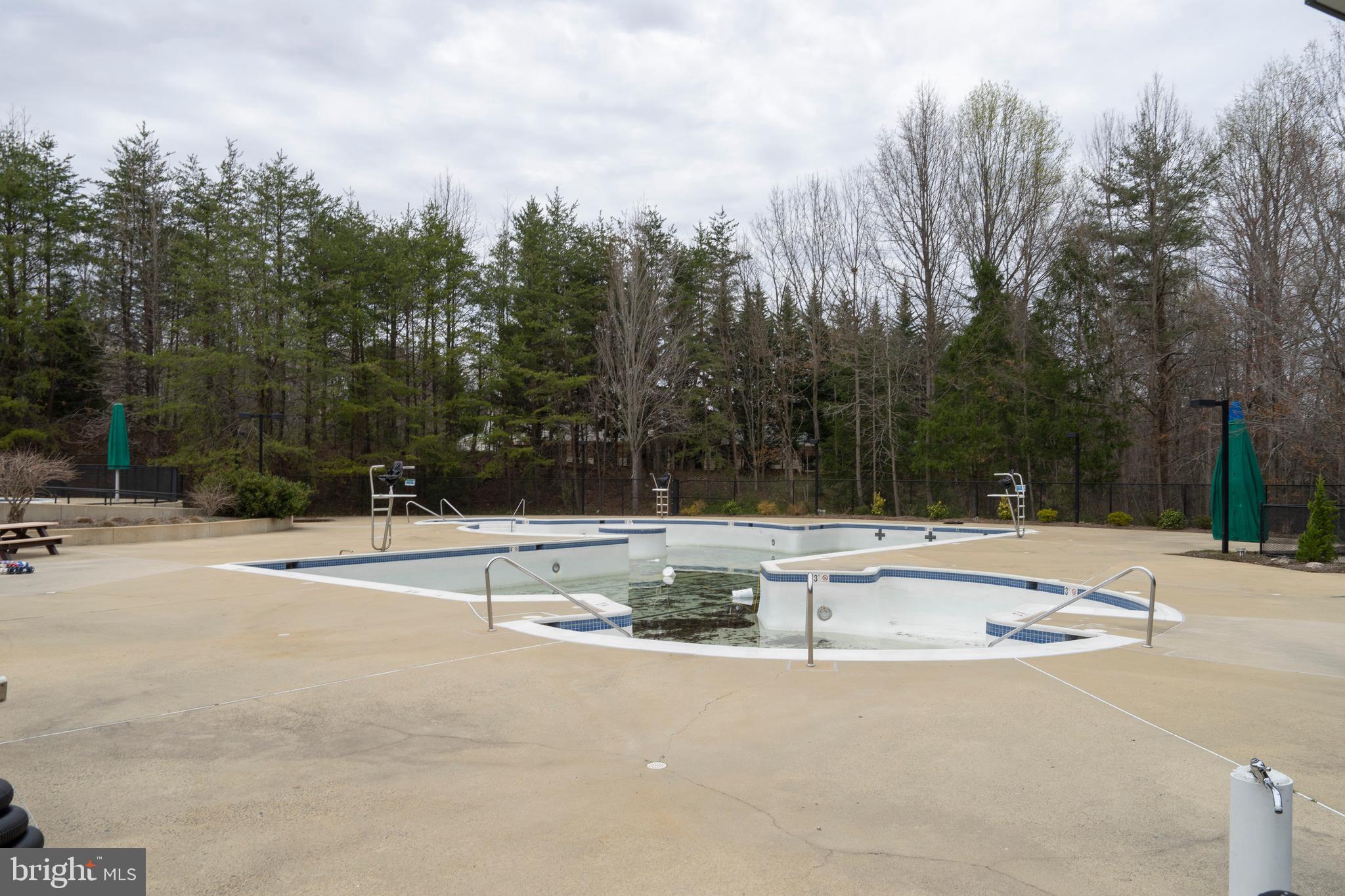 1435 Church Hill Place Reston, VA 20194 - Photo 27 of 30 a view of a swimming pool and a yard
