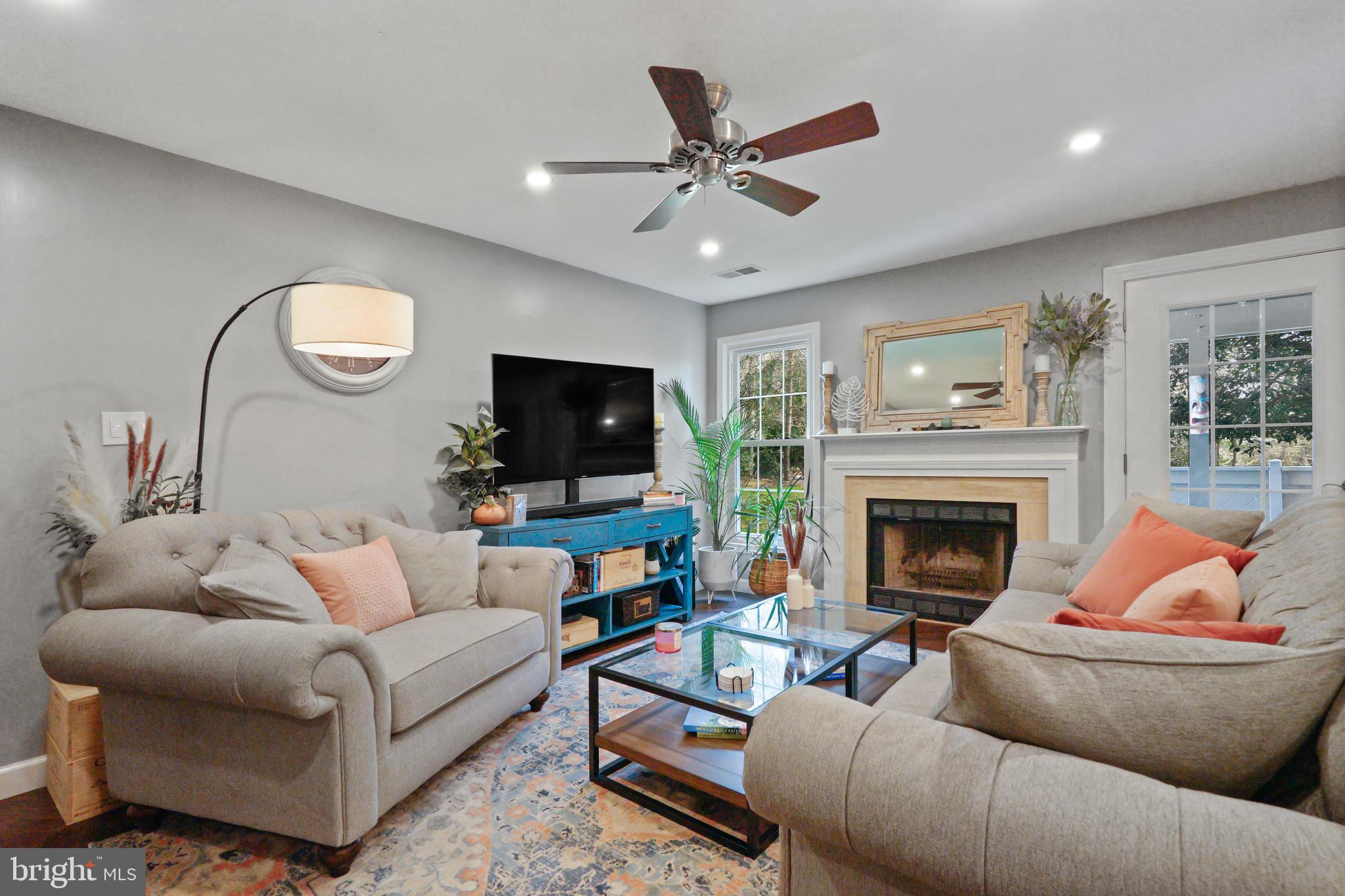 1435 Church Hill Place Reston, VA 20194 - Photo 3 of 30 a living room with furniture and a fireplace