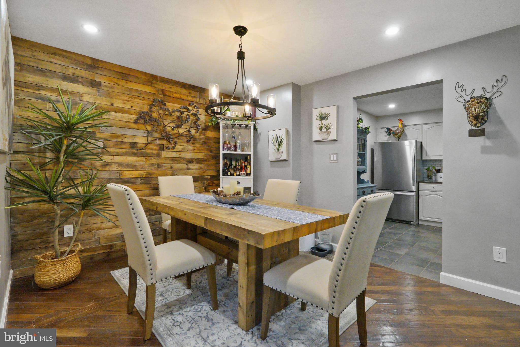 1435 Church Hill Place Reston, VA 20194 - Photo 6 of 30 a view of a dining room with furniture and wooden floor