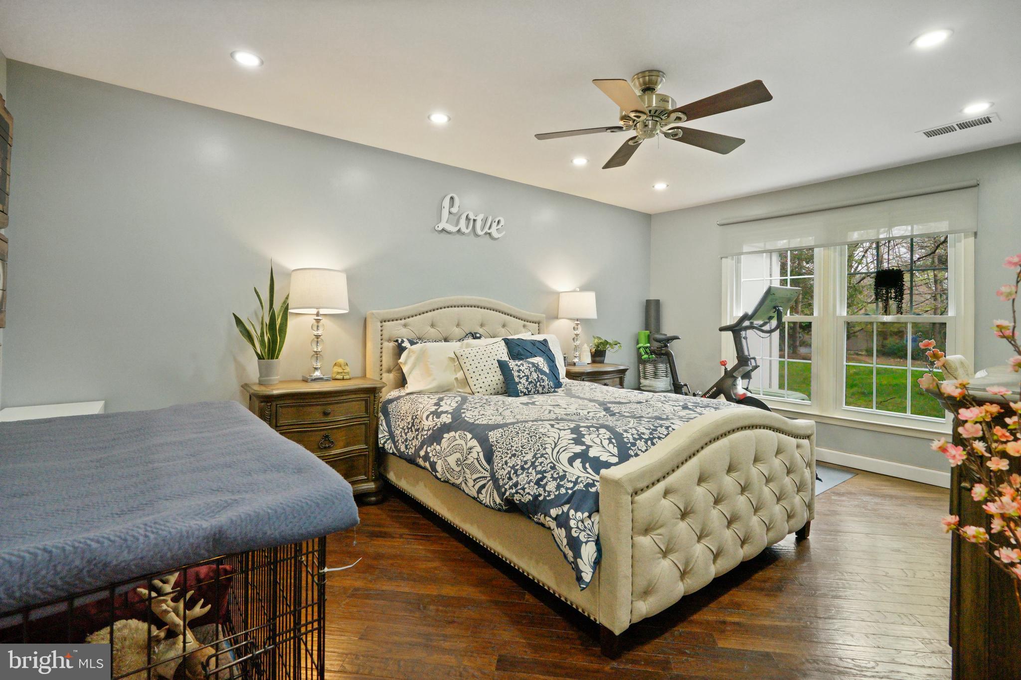 1435 Church Hill Place Reston, VA 20194 - Photo 10 of 30 a bedroom with a bed a window and ceiling fan