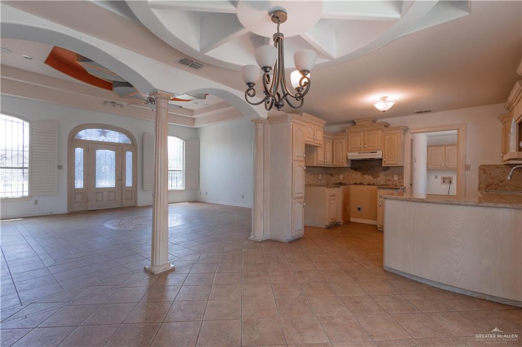 3909 Tulipan Street Mission, TX 78573 - Photo 5 of 18 a view of a kitchen center island and stainless steel appliances