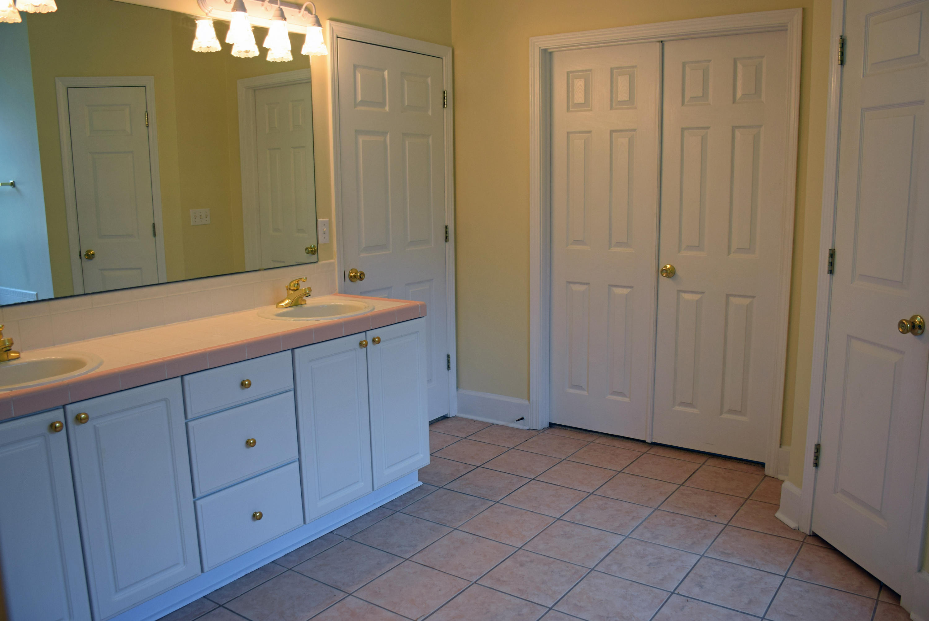 1828 Huntington Road Niceville, FL 32578 - Photo 15 of 27 a spacious bathroom with a sink and a mirror