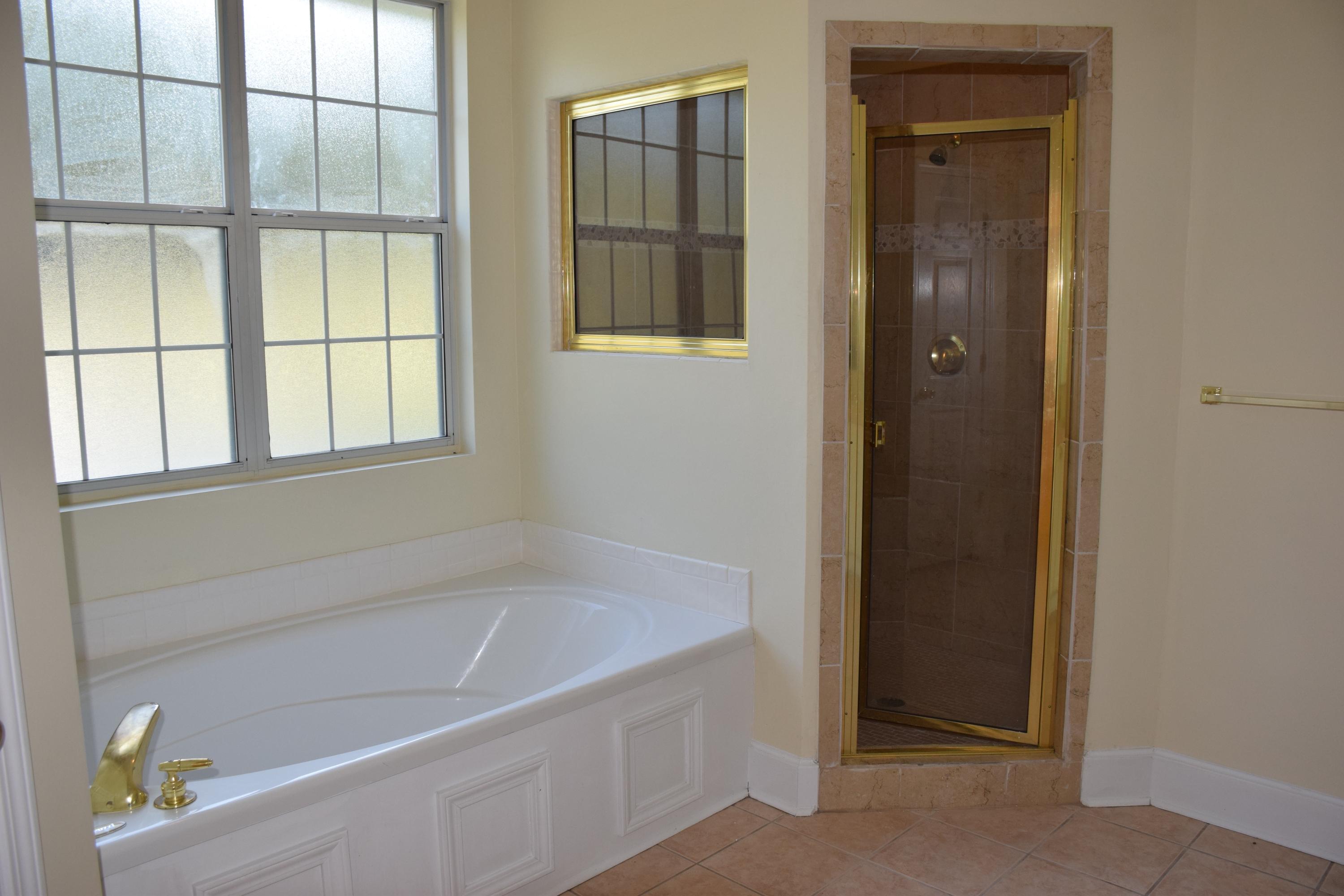 1828 Huntington Road Niceville, FL 32578 - Photo 17 of 27 a white bath tub sitting next to a window