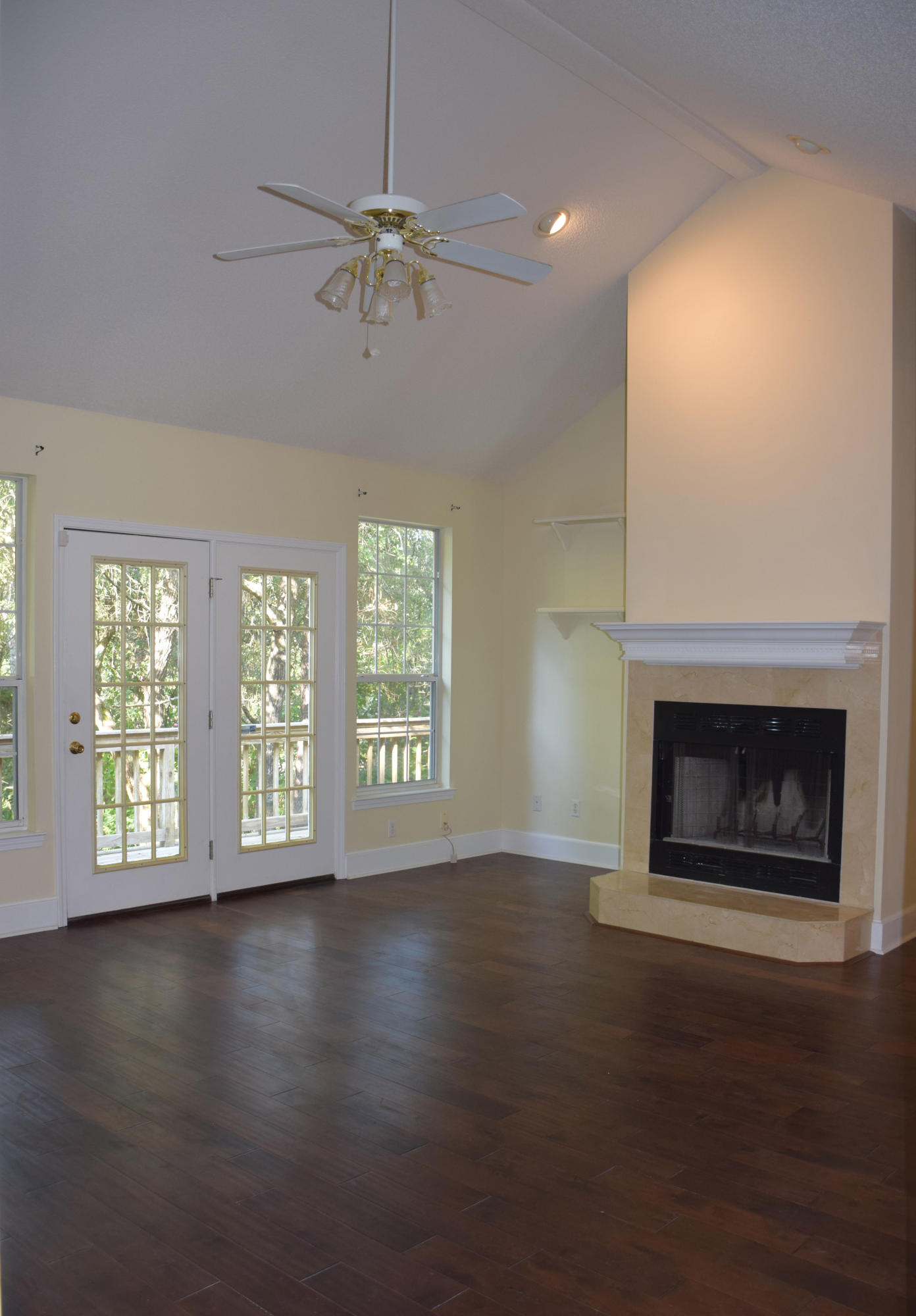1828 Huntington Road Niceville, FL 32578 - Photo 4 of 27 an empty room with windows a fireplace