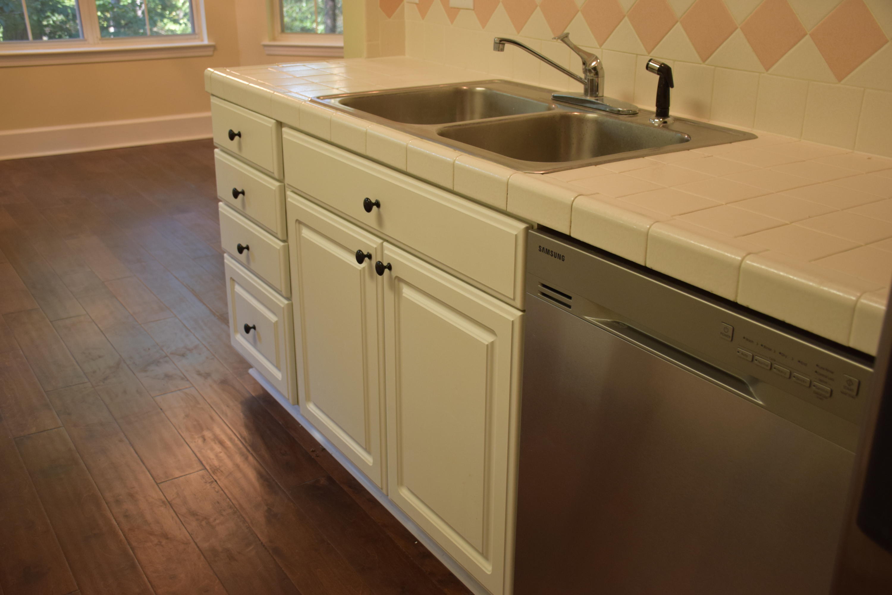 1828 Huntington Road Niceville, FL 32578 - Photo 10 of 27 a close view of a sink and dishwasher with wooden floor
