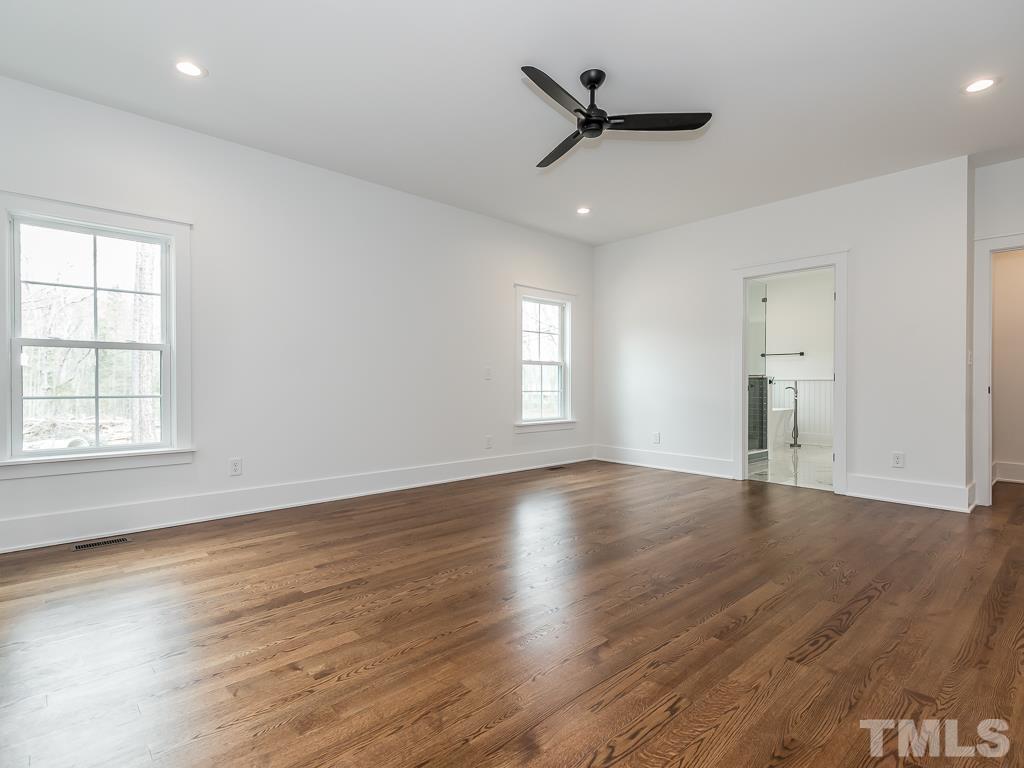 1703 Milton Road Durham, NC 27712 - Photo 17 of 39 wooden floor in an empty room with a window