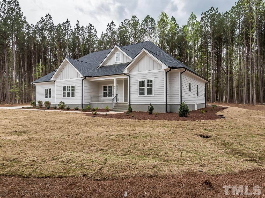1703 Milton Road Durham, NC 27712 - Photo 3 of 39 a front view of a house with a yard