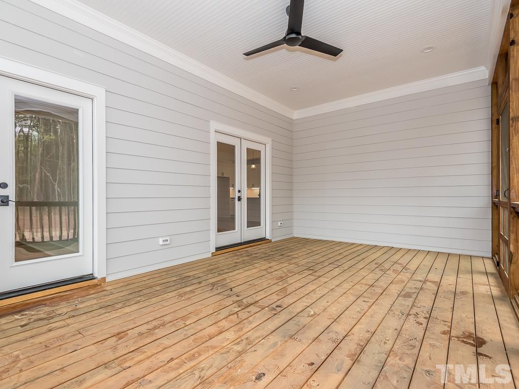 1703 Milton Road Durham, NC 27712 - Photo 35 of 39 a view of an empty room with wooden floor and a window