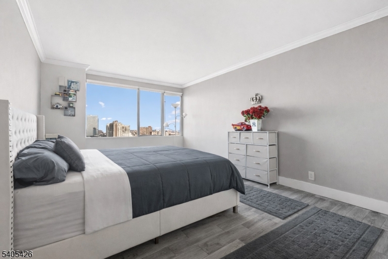 6 Horizon Road, Unit 2809 Fort Lee, NJ 07024 - Photo 15 of 19 a bedroom with a bed and a window