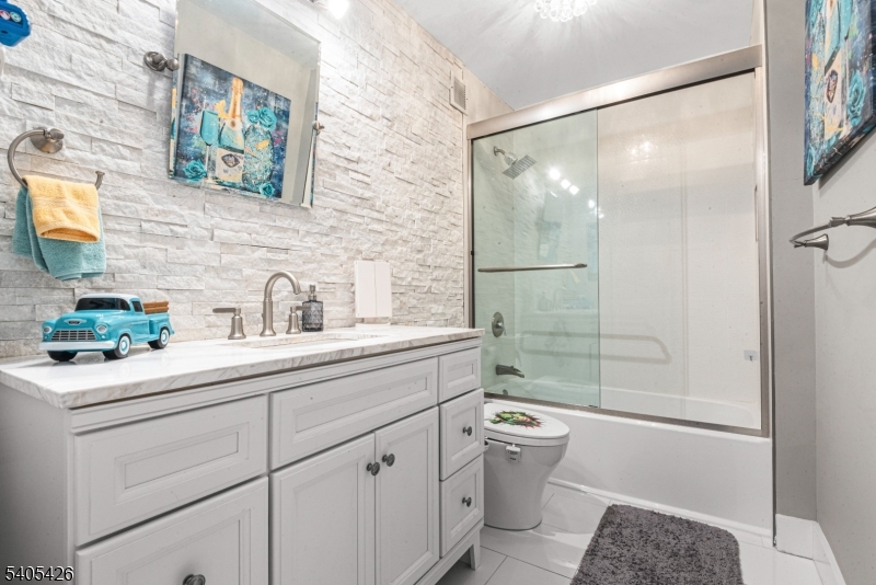 6 Horizon Road, Unit 2809 Fort Lee, NJ 07024 - Photo 16 of 19 a bathroom with a double vanity sink toilet and shower