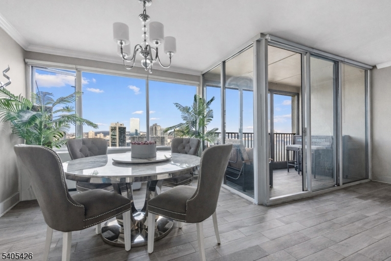 6 Horizon Road, Unit 2809 Fort Lee, NJ 07024 - Photo 4 of 19 a view of a dining room with furniture window and wooden floor