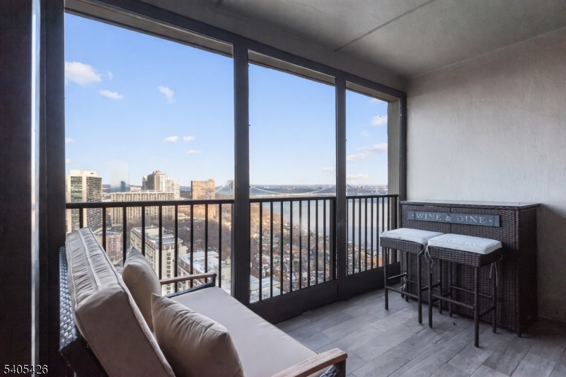 6 Horizon Road, Unit 2809 Fort Lee, NJ 07024 - Photo 6 of 19 a view of a balcony with furniture