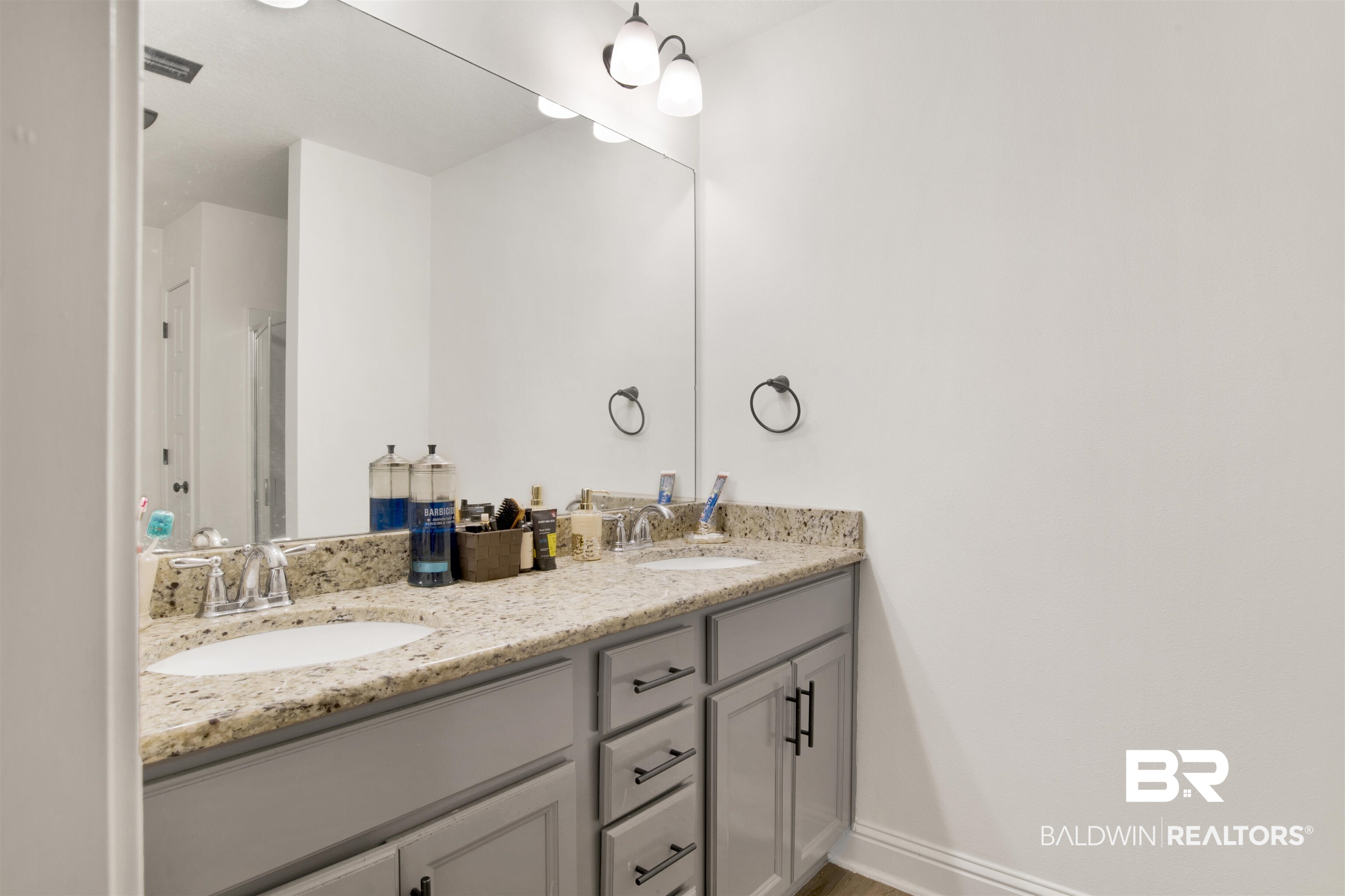 25806 Pollard Road, Unit 80 Daphne, AL 36526 - Photo 8 of 30 Bathroom with double vanity and a stall shower