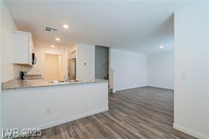 12347 Indigo Montage Road, Unit 3 Las Vegas, NV 89183 - Photo 4 of 23 An open concept design seamlessly connects the kitchen with a spacious living area.