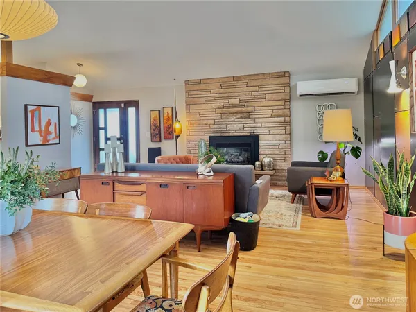 a living room with fireplace furniture and a lamp