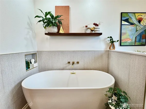 a bathroom with a sink and mirror