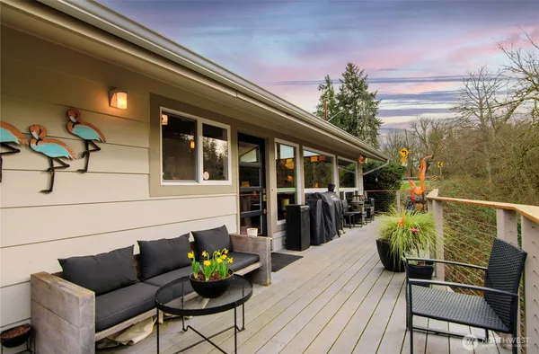 a balcony view with a seating space