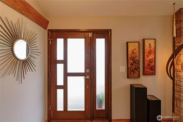 a kitchen that has a table and chairs in it