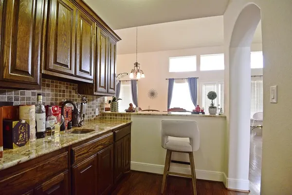 a kitchen with a sink cabinets and window