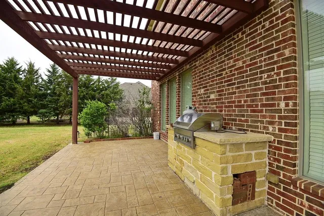 a view of a backyard with sitting area