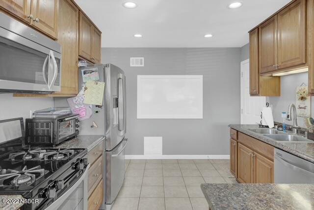 3436 Via Cortez Lompoc, CA 93436 - Photo 5 of 17 a kitchen with stainless steel appliances granite countertop a sink stove and cabinets